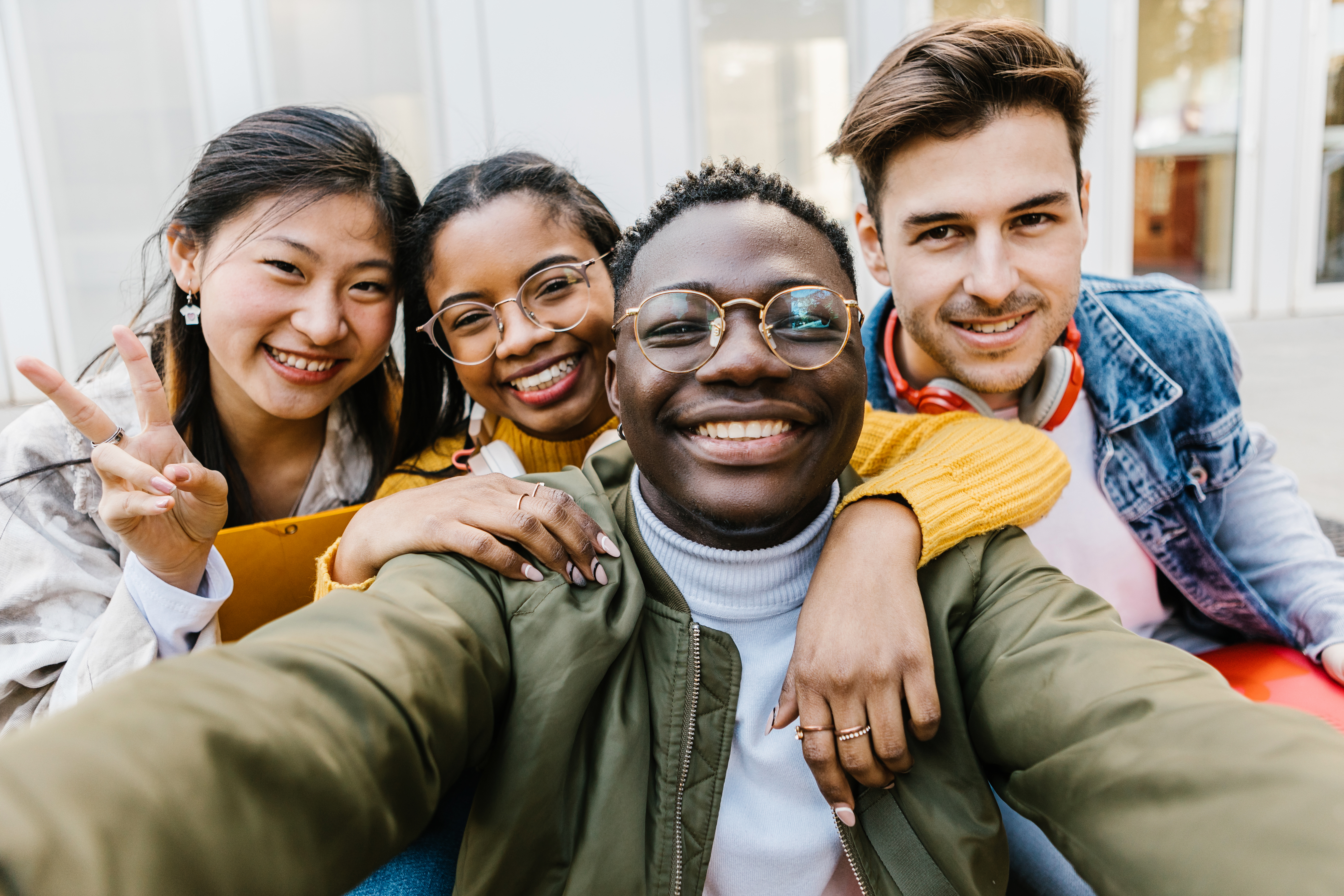 Portrait group of diverse student friends after class at university campus