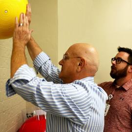 Joe Ubben works to restore his range of motion during a physical therapy session at St. Mary Medical Center's clinic in the Valparaiso YMCA.