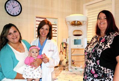 Lisa Bailey and baby Brinleigh visit with certified nurse midwife Colleen Sahy and perinatal coordinator Racquel Krause in the Level II nursery of St. Mary Medical Center's Family Birthing Center.