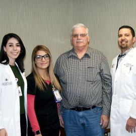 Schneider resident David Durham (second from right) is congratulated by bariatric medicine physician Michael Simpson, MD, (right) and the Hobart Healthy 4 Life team after losing more than 100 pounds with the program.