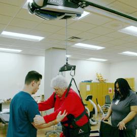 Julie Gaski gets to her feet for the first time in two years after a stroke thanks to the ZeroG Gait and Balance System.
