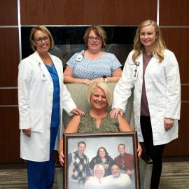 Part of Vicki Negrete's (seated, center) husband Fred's palliative care team at Community Hospital included (left to right) nurse Susan Kelley, social worker Nicole Brundage Lamski and nurse practitioner Amanda LeVin.