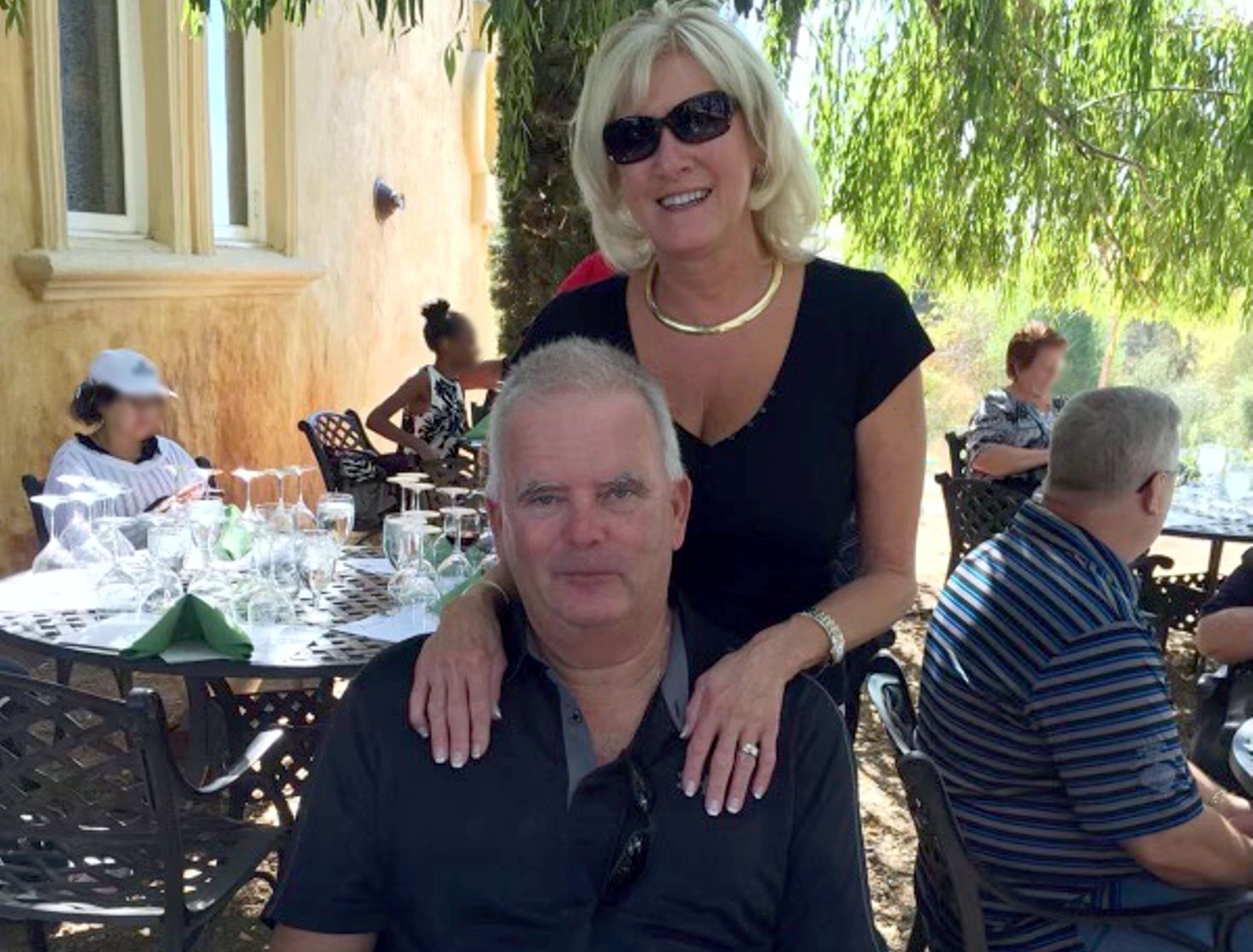 Man and woman smiling at table